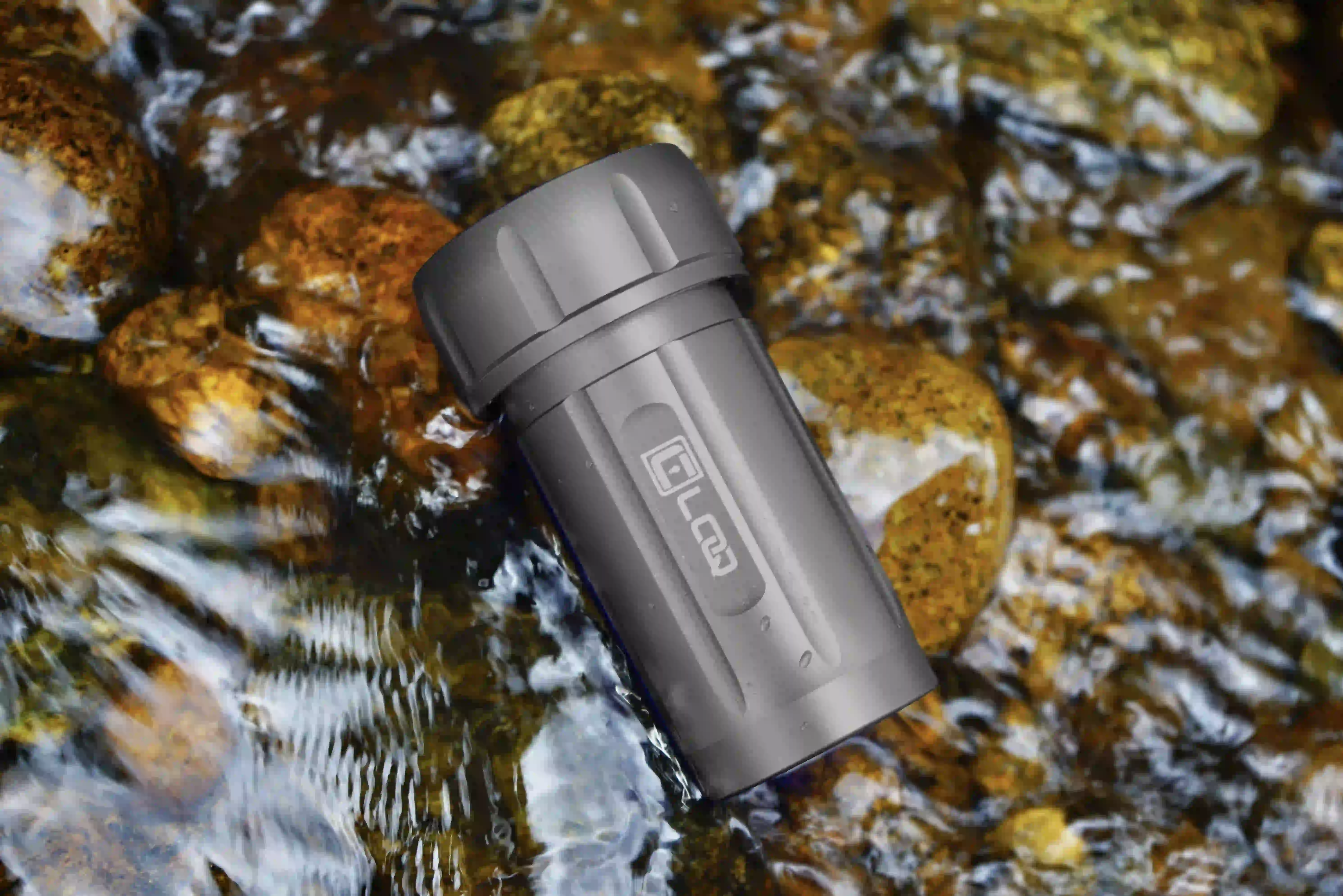 waterproof-corloq-container-gray a gray waterproof corloq container immersed in a flowing river